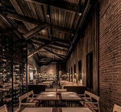 an empty restaurant with wooden tables and chairs