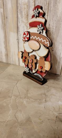 a wooden christmas tree with gingerbreads and bears