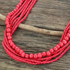 Fair Trade Long Wood Beaded Necklace in Bright Red - Cabana Dance | NOVICA Cheap Red Statement Beaded Necklaces, Cheap Red Beaded Necklaces For Festival, Affordable Red Multicolored Beaded Necklaces, Luxury Hand-strung Red Beaded Necklace, Luxury Red Hand-strung Beaded Necklaces, Cheap Red Beaded Necklace For Statement, Cheap Red Beaded Necklace For Festive Occasion, Cheap Red Traditional Beaded Necklace, Cheap Red Beaded Necklace With Large Beads