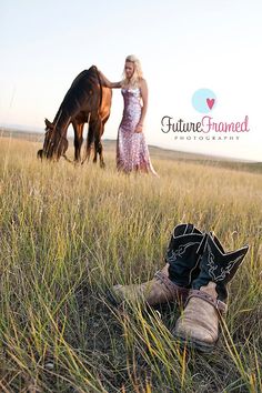 a pair of cowboy boots sitting on top of a grass covered field next to a horse