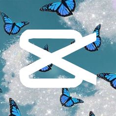 there are many blue butterflies flying in the sky with an x on it's side