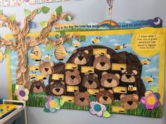 a bulletin board with lots of bees and honeycombs in the shape of a bear