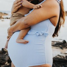 Limited time only! Take 20% off regular-priced swimwear with code SPLASH. As cute as it gets, this best-selling maternity bathing suit can be worn from pregnancy through postpartum. There’s an inner layer with a nursing-friendly crossover cut and an outer layer that wraps around the bust and ties at the side for a wrap effect. Simply untie and pull aside the inner layer to nurse. Flattering ruching for baby bump or postpartum belly Adjustable straps and full shelf bra for support Busty sizes hav Maternity Bathing Suit, Maternity One Piece, Maternity Swim, Nursing Maternity, Wrap Swimsuit, Pumping Bras, Postpartum Belly, Maternity Swimsuit, Pregnancy Wardrobe