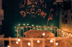 candles are lit in front of a cake with the word dream written on it,