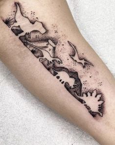 a black and white tattoo on the arm