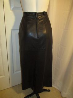 "From around the 1980's. By Creation Jez Montreal. It is marked a size 7, todays size 4, Soft quality leather. Acetate lining. Front pockets. Back zip with snap. Belt loops. Back vent. It measures: 33\" long. Laying flat seam to seam it's 13\" across at the waist, 18 1/2\" at the hips. Very nice condition. Made in Canada. I ship same or next business day." Formal Leather Skirt With Belt Loops, Mannequin Dress, Lounge Robes, Flat Seam, Lace Tunic, Long Knit, Leather Outfit, Montreal, Leather Skirt