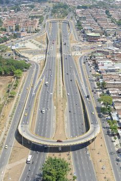 an aerial view of a highway in the middle of a city with lots of traffic