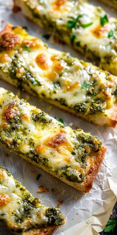 several slices of pizza with cheese and spinach