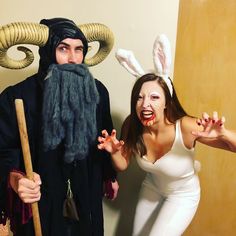 two people dressed up in costumes with horns and beards