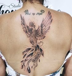 a woman with a tattoo on her back