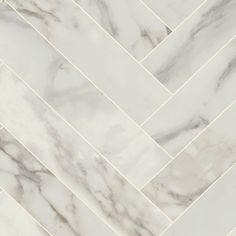 a white marble tile floor that looks like herrings