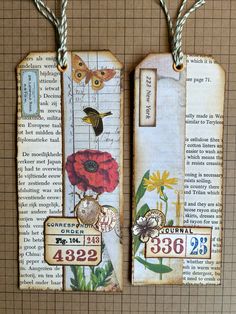 two tags with flowers and butterflies on them hanging from twine strings in front of a book page