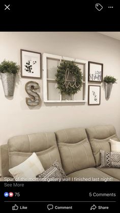 a living room filled with furniture and pictures hanging on the wall above it's couch