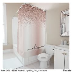 a bathroom with a pink shower curtain and white toilet