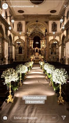 an image of a church with flowers on the aisle