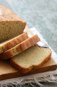 sliced loaf of bread sitting on top of a cutting board