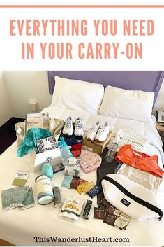 a bed with many items on it and the words carry - on essentials for long - haul flights