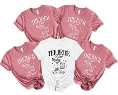 three shirts with the bride and groom's names printed on them, all in pink