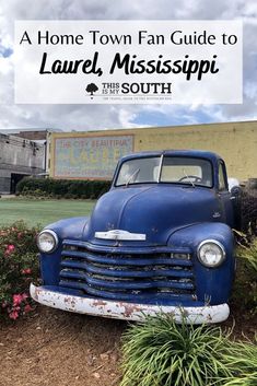 an old blue truck parked in front of a building with the words, a home town fan guide to laurel, mississippi