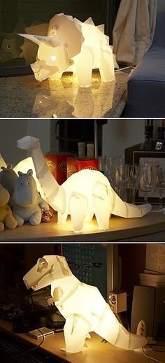 three different images of the same animal made out of paper and light up with lights