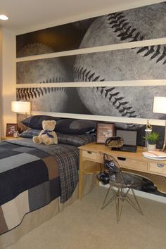 a bedroom with a baseball mural on the wall and a desk in front of it