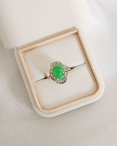 * Ring Material: Jade, Diamond, 14K Yellow Gold * Ring Dimensions: 15.5.1x12.7MM, 1.6mm Band Tapering Width * Size: 4.25 * Stone Weight & sizes: Jade -10.1x8.1MM, Diamond-0.24ct * Overall weight: 5.6g Elegant Green Opal Ring In 14k Gold, Classic Green Opal Ring In 14k Gold, Formal Green Opal Ring In 14k Gold, Elegant Green Opal Oval Ring, Green Opal Ring In 14k Gold, Classic Green Cluster Ring Stamped 14k, Elegant Yellow Gold Jade Rings, Elegant Green Opal Ring For Formal Occasions, Oval Jade Rings In Yellow Gold