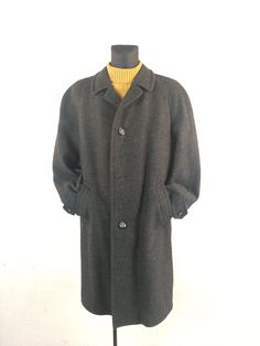 Vintage 70s 80's Dark gray Wool  Long size L Men`s Loden Coat (Check measures before buying) Classic thick resistant fabric coat with 2 pockets outside. Beautiful and unique men's "A.MULLER 94 WIPPERFURTH" overcoat.  Comfortable, very elegant and in good condition. One button is missing (Look foto) The perfect coat for any outdoor activity, for use in the city, celebration. Type:   Loden Coat Color:  Gray Black Size:  US  M/L. Check measures before buying. Material:  Wool, polyamide Flat measure Vintage Overcoat, Vintage Dark Wash Long-sleeved Outerwear, Vintage Single-breasted Long Pea Coat, Vintage Gray Single-breasted Outerwear, Vintage Wool Single-breasted Outerwear, Coat Check, Gray Wool Coat, Overcoat Men, Gray Wool Single-breasted Outerwear