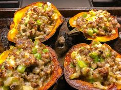 several stuffed peppers with meat and vegetables on them