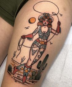 a woman with a cowboy hat and lasso on her thigh is depicted in this tattoo