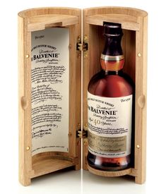 a bottle of rayvene single cask whisky in a wooden case with the label printed on it