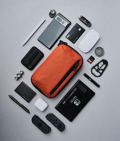 A slim tech case with tons of organization. It has multiple pockets to keep your gadgets neatly stored as well as a zippered front pocket perfect for stowing away loose items like keys or cables. It also comes with a removable shoulder strap and converts into a crossbody bag. Perfect for those grab-and-go moments. Built for the longhaul. Edc Aesthetic, Gadgets And Gizmos For Men, Tech Gadgets For Men, Mochila Edc, Tech Pouch, Tech Bag, Tactical Gear Loadout, Tech Cases, Mens Items