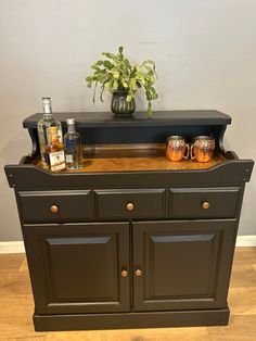 an old dresser with some bottles on it