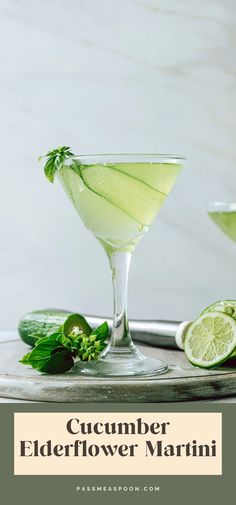 cucumber elderflower martini with mint garnish and limes on the side