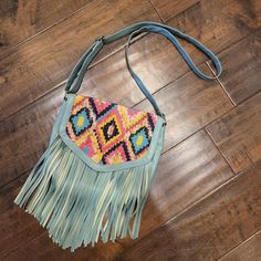 Nwot Boho Aztec Print With Awesome Detail. Faux Leather Light Turquoise With Front Detail And Fringe. Measures 10 X 11 X 1 3/4 Inches. Multicolor Fringe Crossbody Shoulder Bag, Multicolor Fringe Crossbody Bag, Blue Fringe Bags For Daily Use, Blue Fringe Tote Shoulder Bag, Trendy Multicolor Fringe Bag, Blue Fringe Shoulder Bag For Daily Use, Rectangular Pink Bag With Fringe, Pink Fringe Bag For Daily Use, Blue Bags With Adjustable Strap For Festival