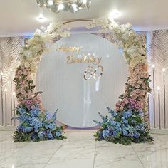 an entrance decorated with white and blue flowers