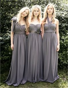 three women in long dresses standing next to each other with the letters abc on them