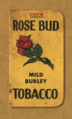 an old matchbox with a rose bud on the front and back cover is shown