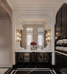 an elegant bathroom with black and white marble flooring, chandeliers and mirrors