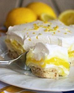 a piece of lemon meringue pie on a plate with a fork