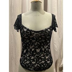 Black Floral Scroll Stretch Lace , Lined In Nude. Very Low Scoop Neck And Wide Set Cap Sleeves In Vintage Scallop Lace. Photographed On A Size 8 Mannequin Unworn, Pristine. Party Tops With Lace Trim And Underbust Shape, Black Tops With Sweetheart Neckline For Party, Black Party Top With Sweetheart Neckline, Black Sweetheart Neckline Top For Party, Flirty Black Lace Tops, Coquette Lace Trim Top For Night Out, Flirty Lace Trim Top For Night Out, Black Underbust Top For Party, Black Coquette Tops For Party