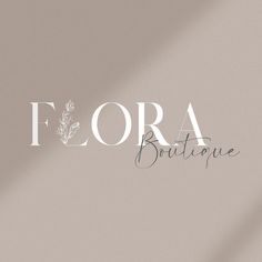 the word flora boutique is written in white on a light gray background with leaves and branches