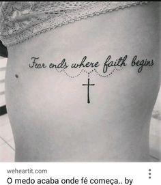 a woman with a cross tattoo on her stomach that says, fear ends where faith begins