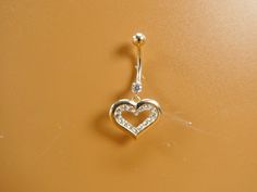 Brand new real solid 14k gold heartdangling body piercing cubic zirconia round stone high polish finish luxury attractive look screw on and off guarantee real solid 14k gold available in 14k whit gold come in nice gift box Bellybutton Piercings, Womens Silver Jewelry, Navel Piercing, Belly Piercing, Belly Button Ring, Button Ring, Belly Ring, Funky Jewelry, Belly Rings