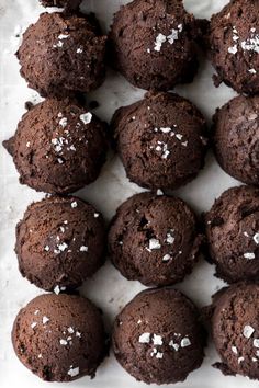 chocolate cookies with white sprinkles in a tray