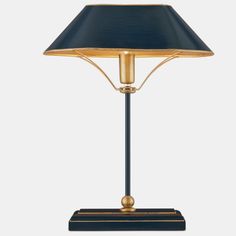 a black and gold lamp with a blue shade