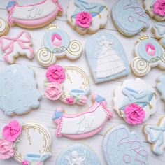 decorated cookies are arranged on a table for a princess themed baby shower or birthday party