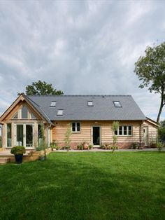 a house with a large lawn in front of it