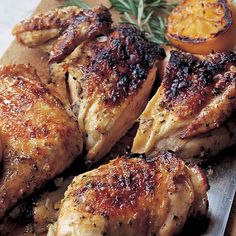 some chicken and tomatoes on a cutting board