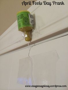 a can of paint is attached to the wall