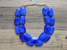 A great statement piece! Two of layers of royal blue transparent Beads that are creamy so they catch the light beautifully. Each acrylic bead is spaced with a small silver bead to give this a polished look! Approximately 16 inches, with a 4 inch chain and silver plated lobster clasp.I can also make this in a single strand for $17.90. Convo me! These make great, affordable bridesmaid necklaces for weddings as well. Ask me about bulk discounts! Need MORE necklaces? Send me a message :) *Smoke and Blue Double Strand Necklaces For Party, Blue Double Strand Necklace For Party, Blue Wedding Bridesmaid, Dark Blue Necklace, Royal Blue Wedding, Chunky Statement Necklace, Double Strand Necklace, Bridesmaid Necklace, Necklace Blue